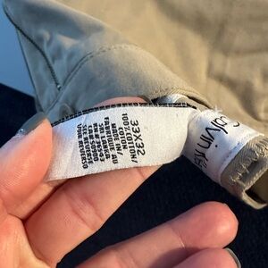 Brand new mens khaki pants by Calvin Klein new w tags 33x32. Have 2 left